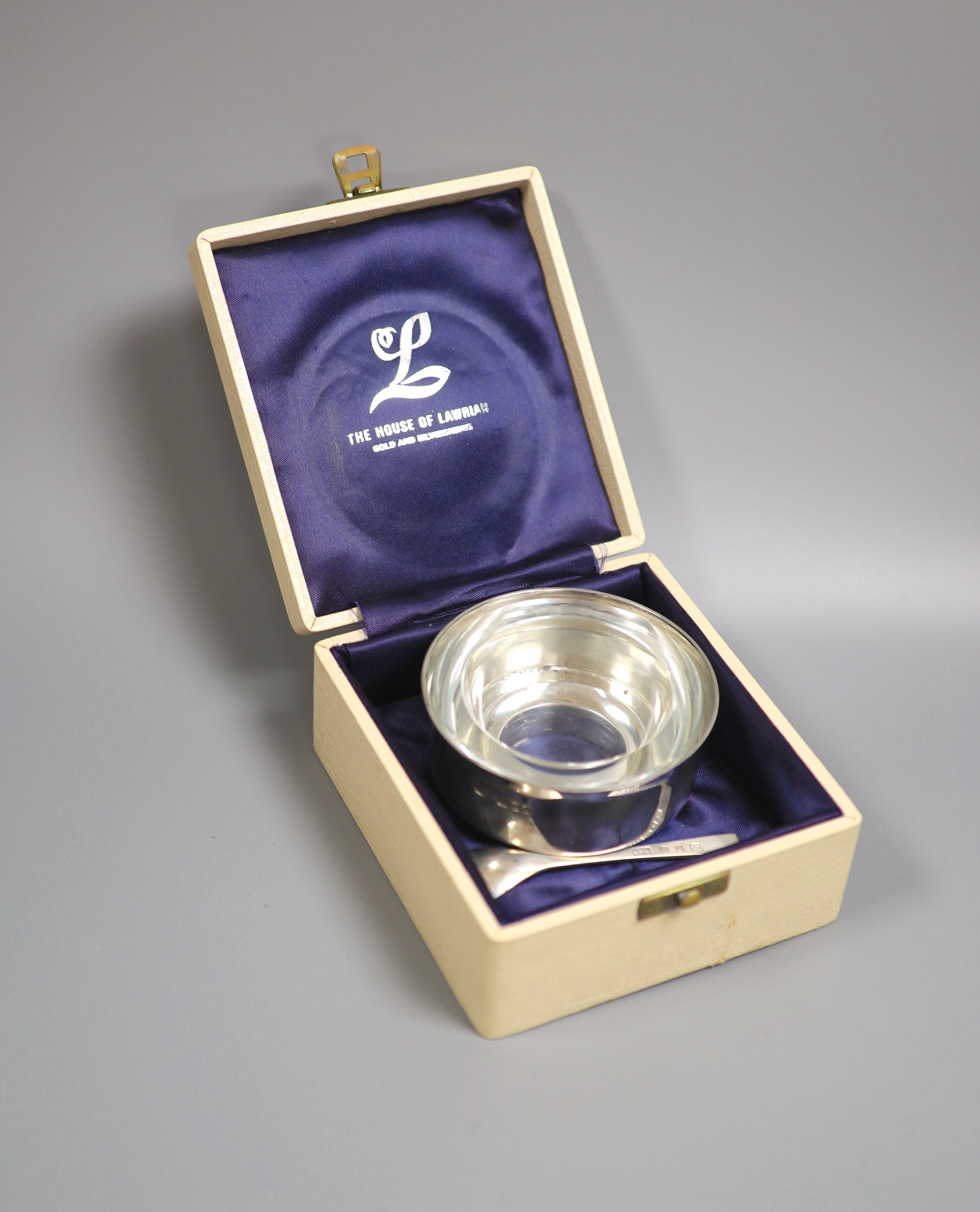 A modern silver mustard pot, with spoon and glass liner, by Christopher Nigel Lawrence, London, 1968, diameter 9.5cm, 169 grams, with box.